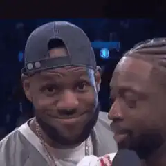 LeBron James smirking at Dwyane Wade