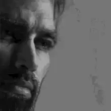 Man smiling in black and white