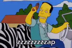 Lenny smoking a cigar in his car