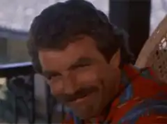Tom Selleck smiling smugly