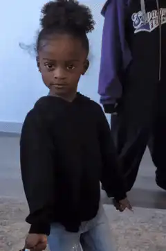 Girl turns and smiles