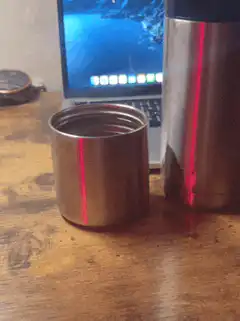 laser pointer on metal cups