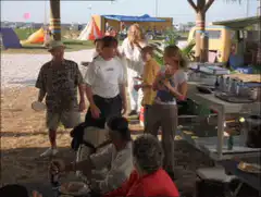 Group of people dancing at a beach party