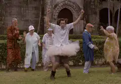 Man in tutu dancing with elderly people