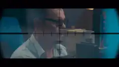 Man seen through sniper scope