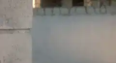 zombie peeking from behind wall