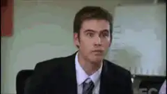 Man yawning in a suit