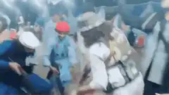 Soldiers in blue uniforms fighting in a crowd