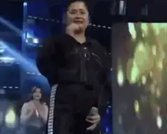 Woman crying on stage