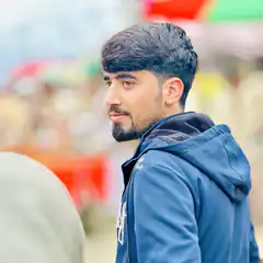 man in blue hoodie looking away