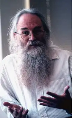 Old man with long beard talking