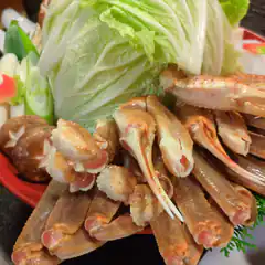 Raw crab legs and vegetables