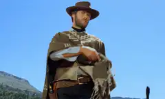 Clint Eastwood puts on poncho