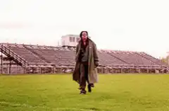 Travis Bickle walking on football field