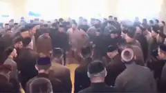 Haredi men dancing in a circle