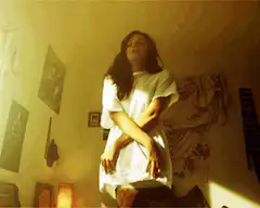girl in white shirt floating up