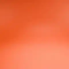 Hand places brick and mallet on orange background
