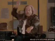 Biff Tannen throws a drink at Marty McFly