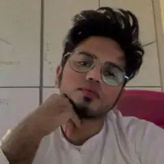man with glasses resting chin on hand