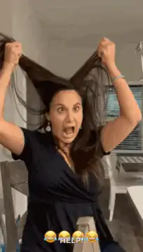woman pulling hair screaming help