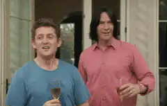Martin Freeman and Keanu Reeves toasting