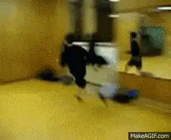 person doing a backflip in a room