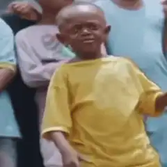 Kid in yellow shirt dancing