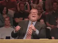 Phil Hartman laughing and clapping