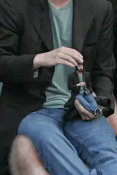 Tiny man in hand