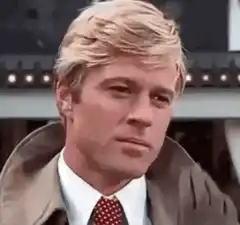Robert Redford adjusting his glove