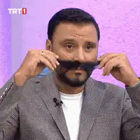 Man twirling his mustache