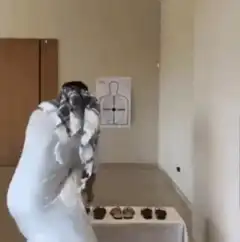 Man throwing shoes at target