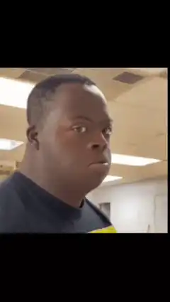 Man turns and covers mouth in shock