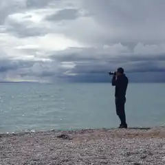 Man taking photo on beach