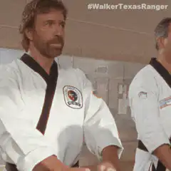 Chuck Norris bows in karate gi