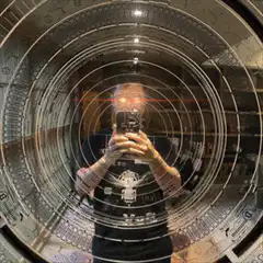 Person shooting lightsabers in mirror