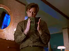 Man puts on green mask