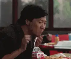 Ken Jeong eating spaghetti and milk