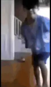 Toddler dancing in blue shirt