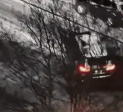 Car drifting in snow with GM text