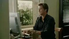 Jim Carrey typing on computer