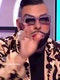 Aziz Ansari gesturing on talk show