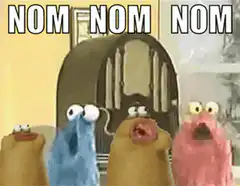 Sesame Street characters eating with text NOM NOM NOM