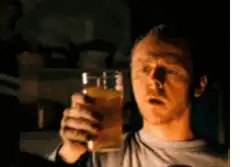 Man drinks beer and spills it