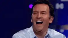 Man laughing then facepalming