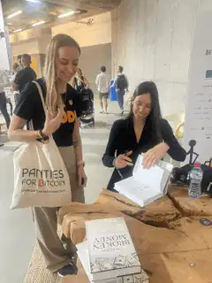 Woman with Panties for Bitcoin bag at book signing