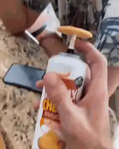 Man watches cheese puff grow on whipped cream can