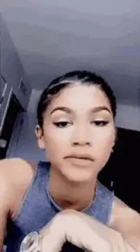 Zendaya posing and looking around