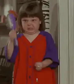 Angry girl with purple hairbrush
