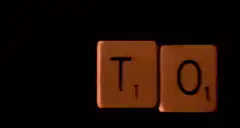 Scrabble tiles spell TOY MANUFACTURERS